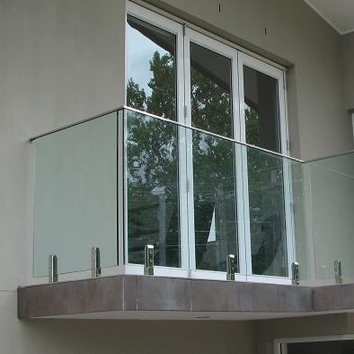 Stainless steel balcony spigot railing with 12mm clear laminated glass panel